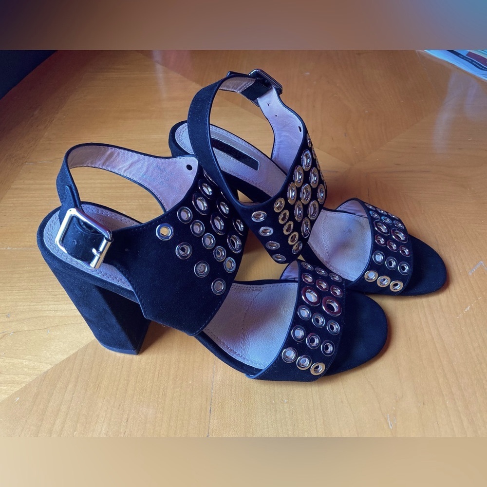 Black sandals with 4” heel. Leather inside trim, suede on the outside. Size 8/38